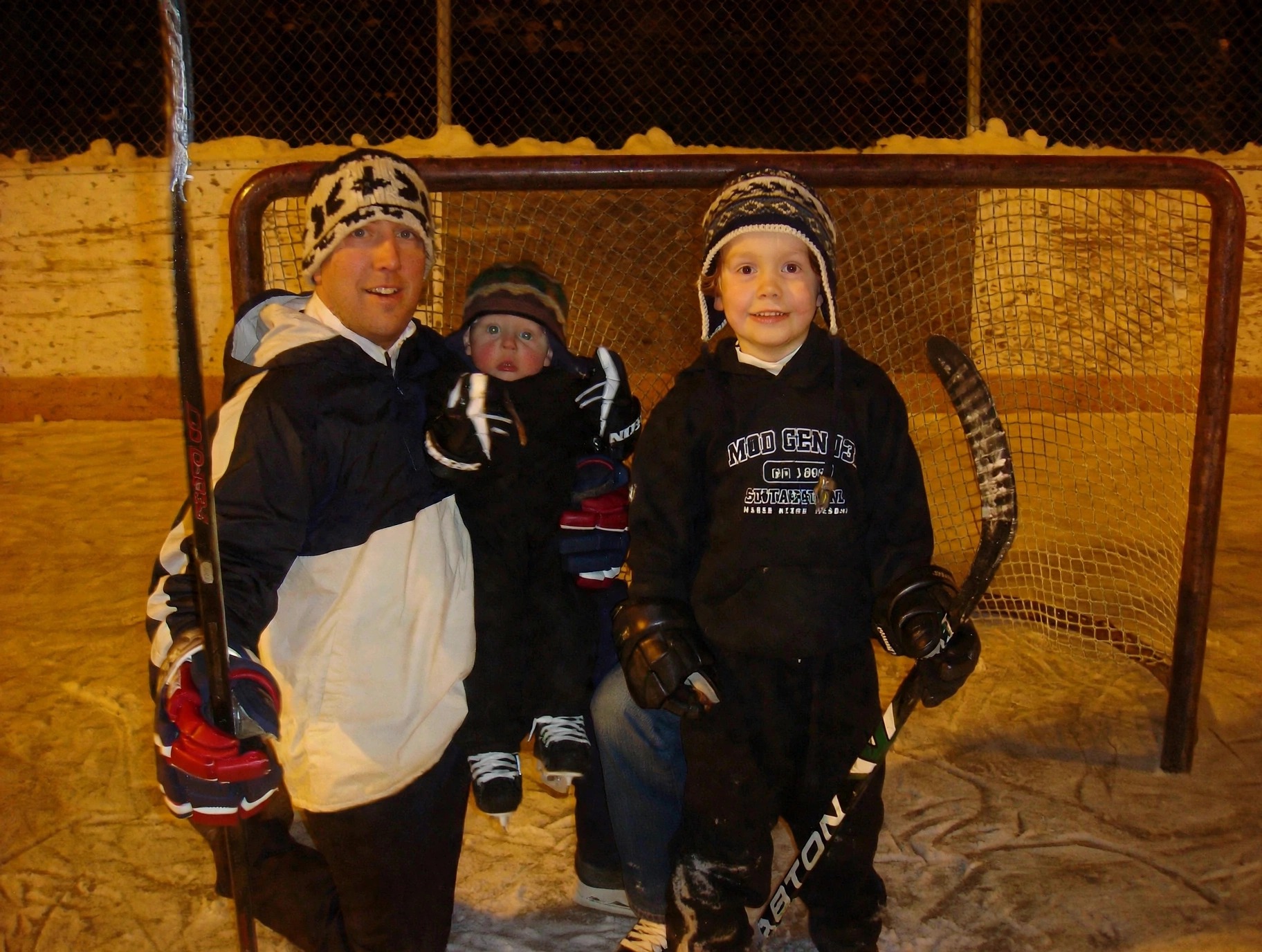 The Miessner family playing hockey on an outdoor rink